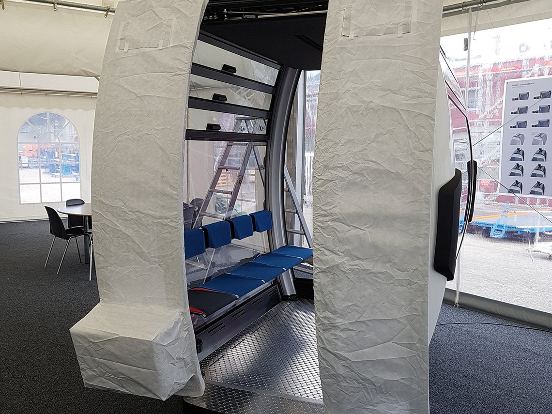 Open cable car cabin enclosed by a FleeceGuard protective cover