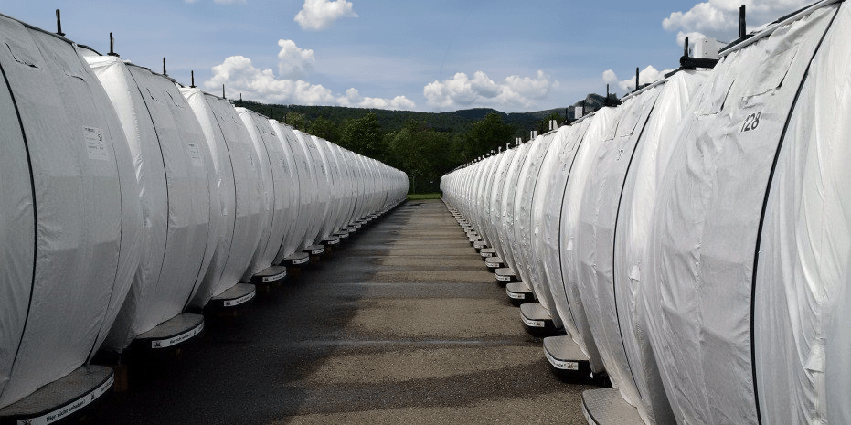 Cable car cabins wrapped with FleeceGuard in rows on an outdoor storage area